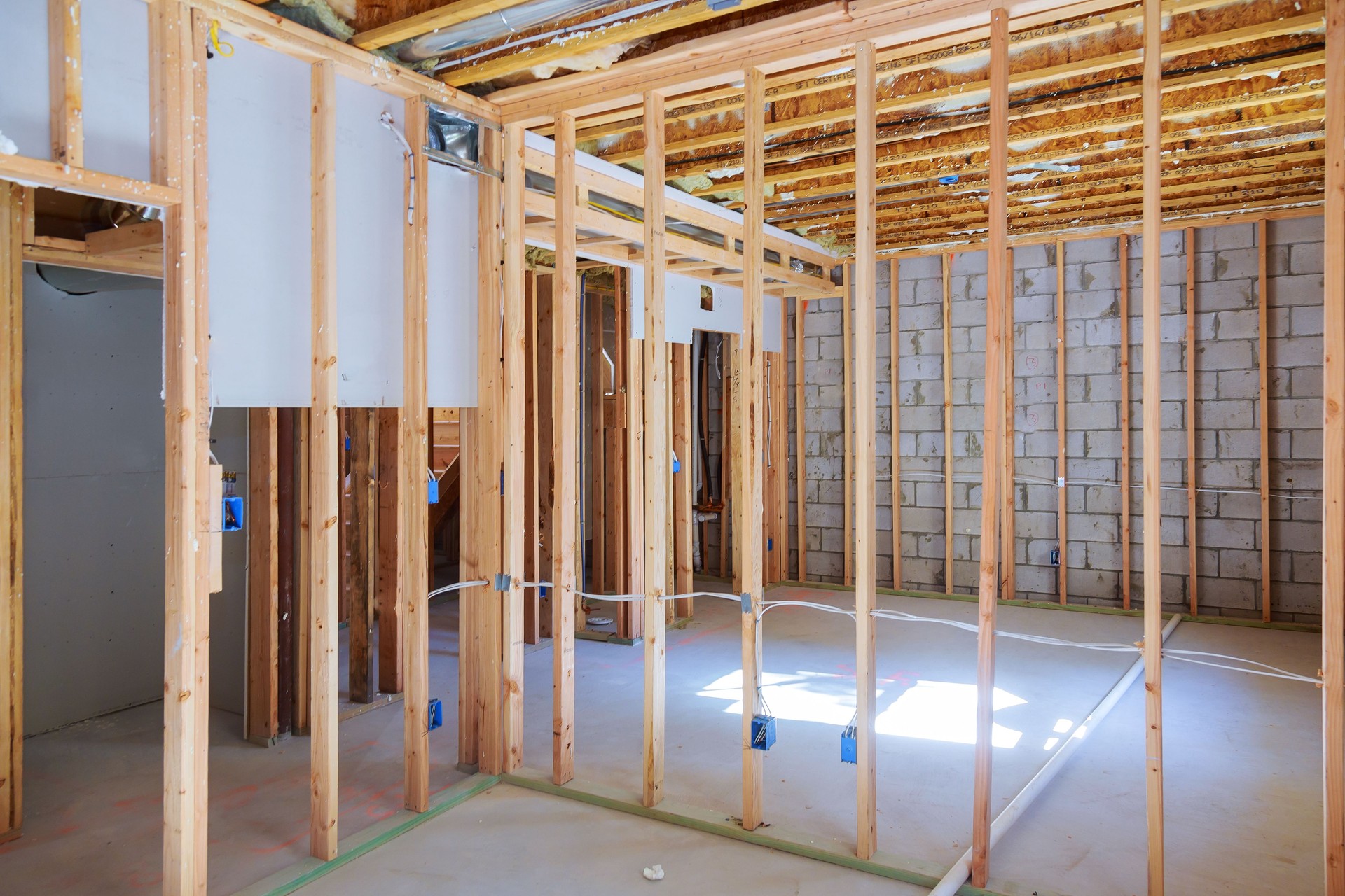 New residential construction home framing with basement view